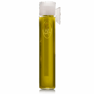 A tall glass vial filled with yellowish liquid and sealed with a white cap.