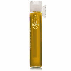 Tall bottle of golden liquid with a white cap and attached spout.