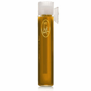 Tall glass of light beer with foam and a logo on the glass.