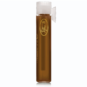 Tall glass of iced coffee with a straw and logo on the front.
