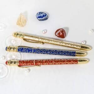 Decorative pens with gemstones and crystals.